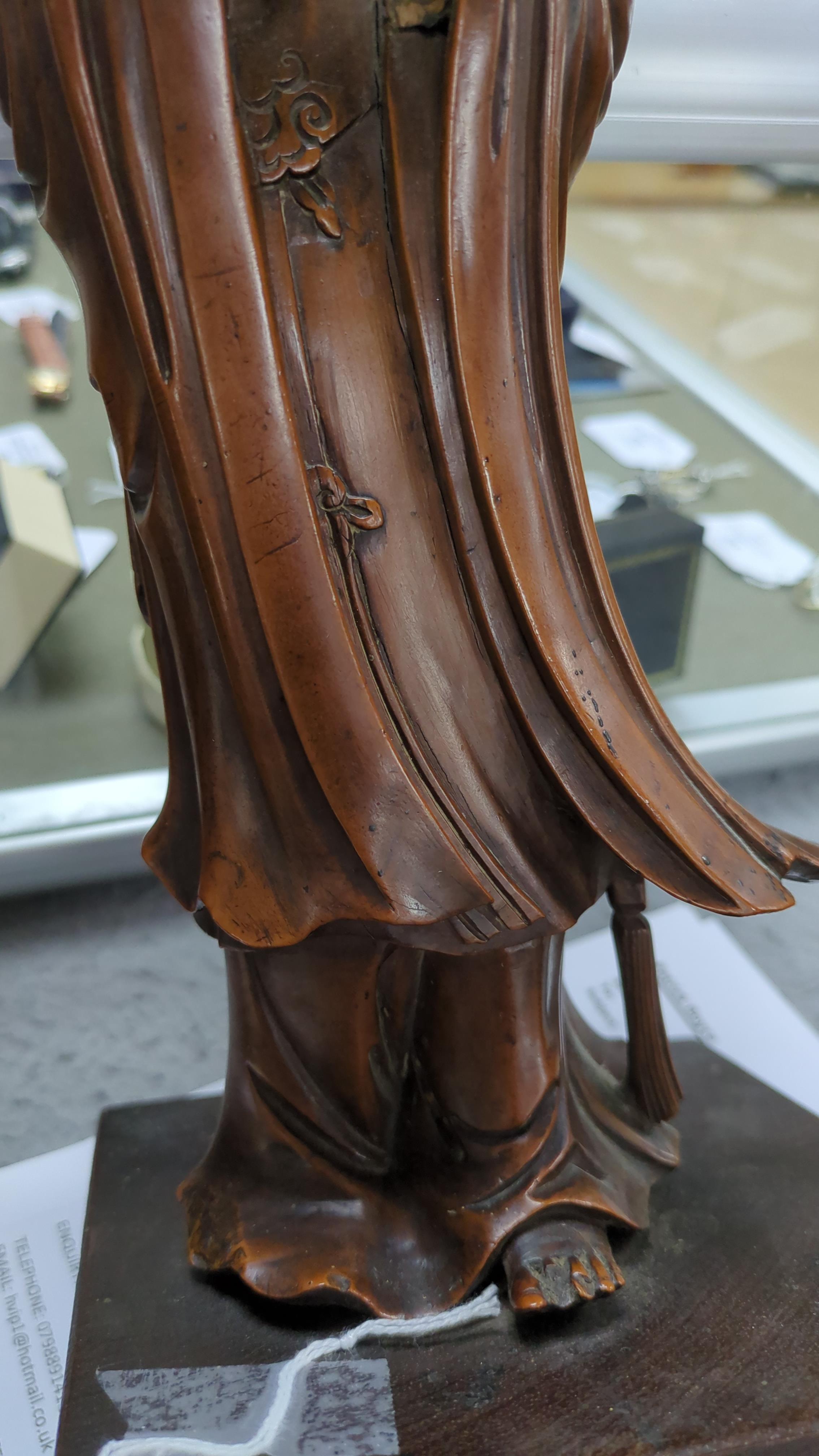 A Chinese carved boxwood figure of Guanyin, 19th century, 37cm high